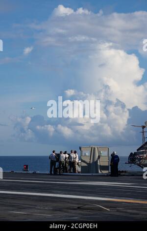 Landing Signal Officers (LSO) guide a A T-45C Goshawk, on it’s approach to USS Gerald R. Ford's (CVN 78) flight deck Sept. 10, 2020. Ford is underway in the Atlantic Ocean conducting carrier qualifications. (U.S. Navy photo by Mass Communication Specialist 3rd Class Dalton Lowing) Stock Photo