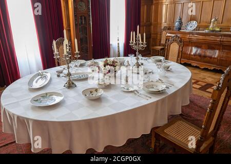 Herbst Palace Museum interior in Lodz, Poland, dining room in 19th century residence, table service Flora Danica Stock Photo