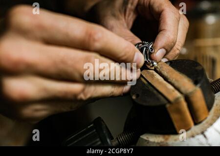 close-up. The jeweler makes a silver ring. On the island of Bali. Indonesia Stock Photo