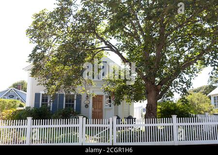 White picket fence house in Chatham, Massachusetts, United States. Stock Photo