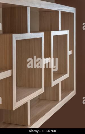 light brown wooden furniture, geometric lines and minimalist style with squares and brown wall background Stock Photo