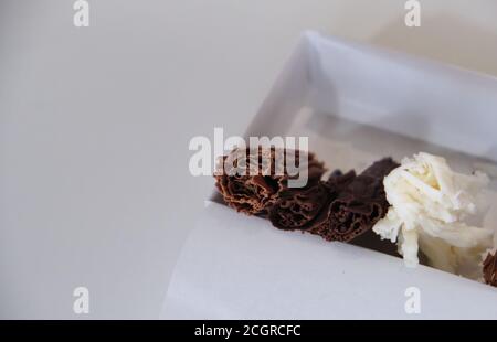 chocolate rolls. chocolate firewood. homemade dark, white and milk chocolate sticks Stock Photo