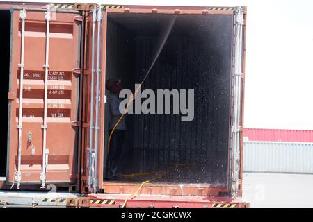 Employees are cleaning the containers. Stock Photo