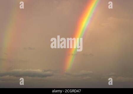 rainbow colorful in fogy sky at dawn at dawn image is taken at gokarna karnataka india. it is showing the colorful art of nature. Stock Photo