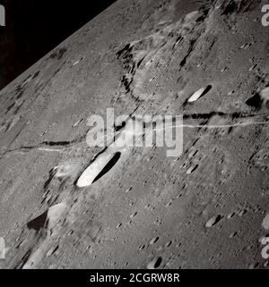 This oblique view of the Moon's surface was photographed by the Apollo 10 astronauts in May of 1969. Center point coordinates are located at 13 degrees, 3 minutes east longitude and 7 degrees, 1 minute north latitude. One of the Apollo 10 astronauts attached a 250mm lens and aimed a handheld 70mm camera at the surface from lunar orbit for a series of pictures in this area. Stock Photo