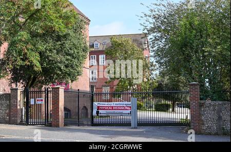 Brighton UK 12th September 2020 -  Cardinal Newman Catholic School and Newman College in Hove Brighton where two members of staff and three students have recently tested positive e for COVID-19 coronavirus . It is believed the students from the Cardinal Newman Sixth Form College had attended a social gathering before the new term began   : Credit Simon Dack / Alamy Live News Stock Photo