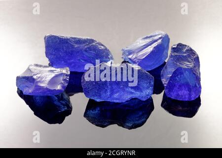 Steel Blue Tumbled and Tempered Fire Glass Nuggets Stock Photo