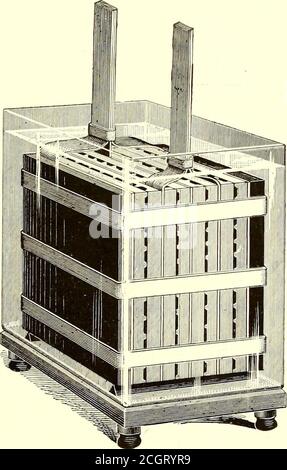 . The Street railway journal . FIG. 1.—FACE OF BATTERY PLATE FIG. 2.—BACK OF BATTERY PLATE FIG. 3.—COMPLETE BATTERY CELL construction of this storage battery. The improvements are of apurely mechanical nature, and relate to the construction of theelement, the general aim being to reduce the weight of the ma-terial supporting the lead oxide, which is, in most batteries, leaditself, one of the heaviest of the metals. In constructing the Hatchelement a porous plate of unglazed earthenware about 4 ins.square is used, with square receptacles on one side and grooves onthe reverse side, as shown in F