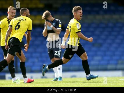 Harrogate Town's Lloyd Kerry (right) celebrates scoring his side's second goal of the game during the Sky Bet League Two match at Roots Hall, Southend. Stock Photo