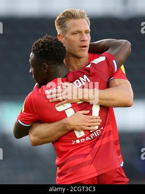 Reading's Andy Yiadom (left) and Michael Morrison embrace after the Sky Bet Championship match at Pride Park, Derby. Stock Photo