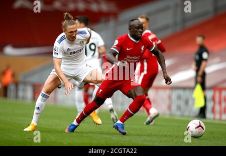 Liverpool's Sadio Mane (right) and Leeds United's Luke Ayling battle for the ball during the Premier League match at Anfield, Liverpool. Stock Photo