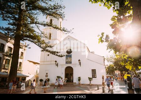 People walking near church of El Salvador in Nerja, Spain Stock Photo