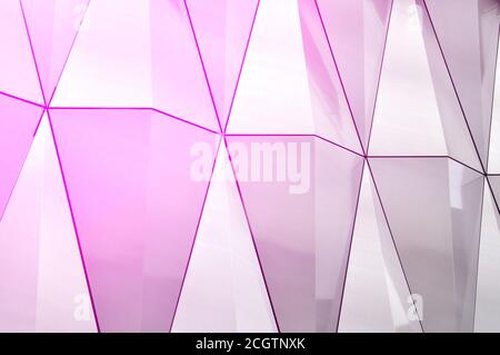 Mirror surface of stainless steel with crystals in the wall, decor and reflection. Abstract glass background. Polygonal surface. Stock Photo