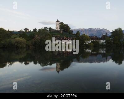 Reflection of Schloss Werdenberg Castle in Werdenbergersee in Buchs, St. Gallen, Switzerland Stock Photo