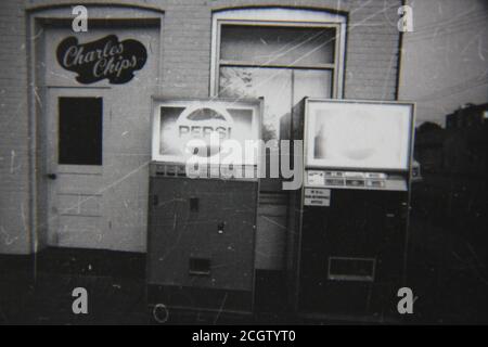 Fine 70s vintage black and white photography of the Pepsi vending machines.