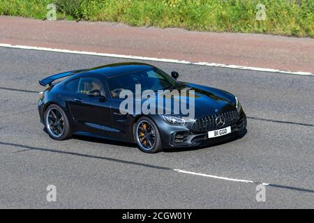 2017 Black Mercedes-Benz AMG GT R Premium Auto; Vehicular traffic moving vehicles, cars driving vehicle on UK roads, motors, motoring on the M6 motorway highway network. Stock Photo