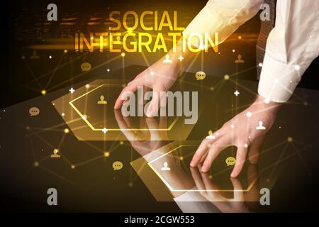 Navigating social networking with SOCIAL INTEGRATION inscription, new media concept Stock Photo