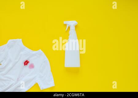 red currant stain on white clothes. isolated on yellow background.top view Stock Photo