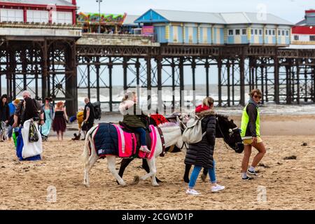 Blackpool, Lancashire, United Kingdom. 12th Sep, 2020. Donkeys rides on the beach in front of the Blackpool Tower Credit: PN News/Alamy Live News Stock Photo