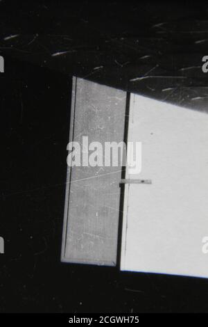 Fine 70s vintage black and white photography of the bright sun shining on a wall. Stock Photo