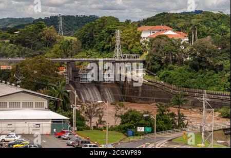 City of Knowledge, Panama - November 30, 2008: Miraflores locks. Excess water in the canal being dumped on side of locks. Cloudscape and green mountai Stock Photo