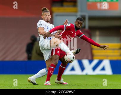 Liverpool. 13th Sep, 2020. Liverpool's Georginio Wijnaldum (R) is dispossessed by Leeds United's Kalvin Phillips during the English Premier League match between Liverpool FC and Leeds United FC at Anfield in Liverpool, Britain, Sept. 12, 2020. Credit: Xinhua/Alamy Live News Stock Photo