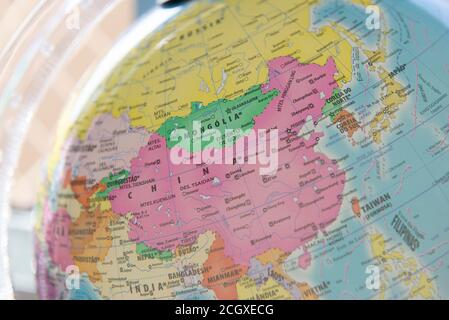 Close Up Of Terrestrial Globe With Focus On Asia and Europe. Focus on China. Stock Photo