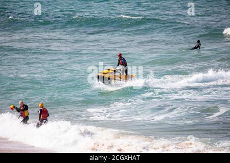 Sydney surf rescue lifeguards at Palm beach practice water manoeuvres and training on their jet ski watercraft, Sydney,NSW,Australia Stock Photo