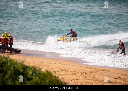 Sydney surf rescue lifeguards at Palm beach practice water manoeuvres and training on their jet ski watercraft, Sydney,NSW,Australia Stock Photo