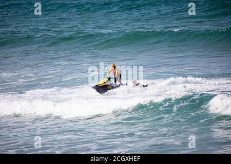 Sydney surf rescue lifeguards at Palm beach practice water manoeuvres and training on their jet ski watercraft, Sydney,NSW,Australia Stock Photo