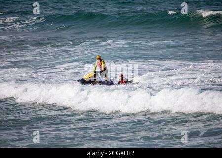 Sydney surf rescue lifeguards at Palm beach practice water manoeuvres and training on their jet ski watercraft, Sydney,NSW,Australia Stock Photo