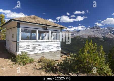 Heritage Fire Lookout Wood Building Structure Exterior. Scenic Canadian Rocky Mountain Peaks Landscape, Yoho National Park, British Columbia, Canada Stock Photo