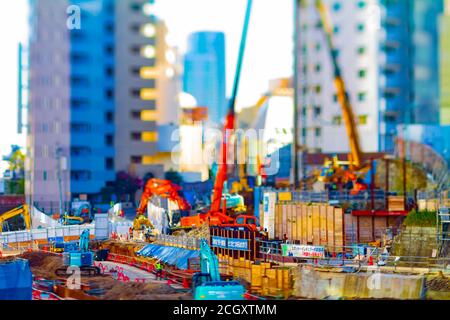 Miniature cranes at the under construction tiltshift Stock Photo