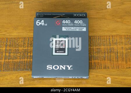 Irvine, Scotland, UK - September 11, 2020: Sony 64gb XQD memory card in recyclable cardboard packaging. One of the high performance memory cards in th Stock Photo