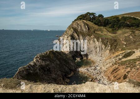 Lulworth Cove, Dorset, UK. 12 September, 2020. Looking toward a secret beach just West of Lulworth Cove. The sunshine brought visitors out to Lulworth Cove, Saturday as the UK sees the return of warm weather. Credit: Sidney Bruere/Alamy Live News Stock Photo
