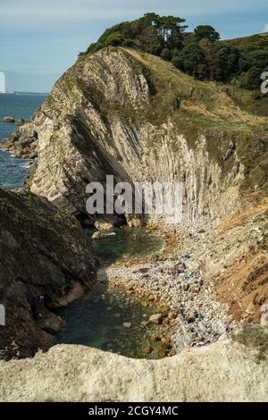 Lulworth Cove, Dorset, UK. 12 September, 2020. Looking toward a secret beach just West of Lulworth Cove. The sunshine brought visitors out to Lulworth Cove, Saturday as the UK sees the return of warm weather. Credit: Sidney Bruere/Alamy Live News Stock Photo