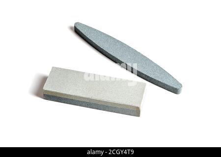 Two Sharpening stones. Grindstone or whetstone sharpener, isolated on white background. Kitchen utensils Stock Photo