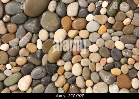 Pile sea gray stones Background from sea wet gray stones Stock Photo