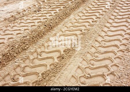 Tire tracks in sand Stock Photo