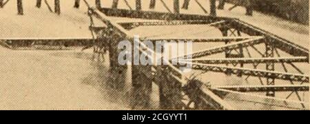 . Baltimore and Ohio employees magazine . THE DUEL OF THE CRANES—FIFTEEN PACES was twisted and crumpled into half that length andjammed through the low arch of the Y bridge below.Two more spans followed. In the Zanesville station the water rose six feet in twohours; the various employes who had gathered there weredriven out. We didnt have our clothes off for three days, saidAssistant Trainmaster Haver. I reported to Mr.Williams at Wheeling by long distance telephone, and he Stock Photo