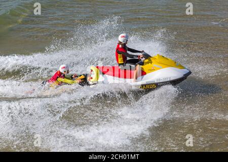 Bournemouth, Dorset UK. 13th September 2020. RNLI Lifeguards on jet ski jetski in the sea at Bournemouth beach, seaside. Credit: Carolyn Jenkins/Alamy Live News Stock Photo