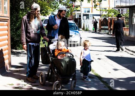 Hasidim on Belinsky street in Uman, Ukraine before Rosh-ha-Shana 2020 (5781), many religious tourists arrive here to Tzaddik Nachman tomb to celebrate Stock Photo