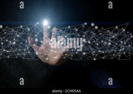 Hand Holding Digital Polygonal Wireframe Hologram Over Dark Background, Creative Design, Connections system and datas exchanges Stock Photo
