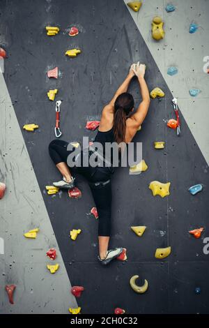 portrait of a sporty woman in boulder climbing hall Stock Photo - Alamy