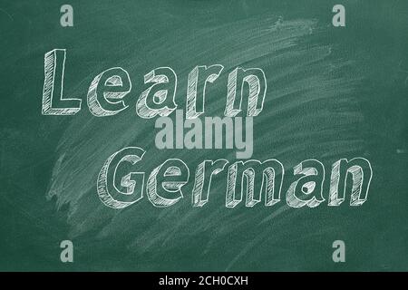 Hand drawing 'Learn German' on green chalkboard Stock Photo