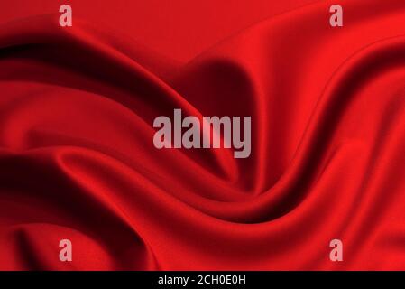Red silk or satin luxury fabric texture can use as abstract background. Top view. Stock Photo