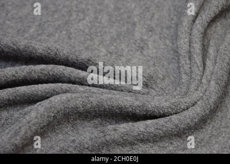 Close up texture of fabric for coat. Gray woolen fabric. Gray background. Stock Photo