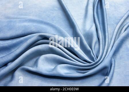 Linen fabric denim blue background. Wrinkled soft Linen blue fabric texture. Stone washed blue pure linen tablecloth background Stock Photo