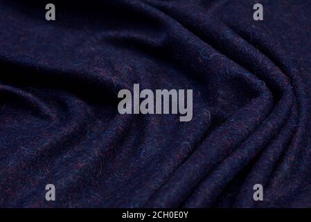 Dark blue wool for coat. Close up texture of the fabric is useful as a background. Stock Photo