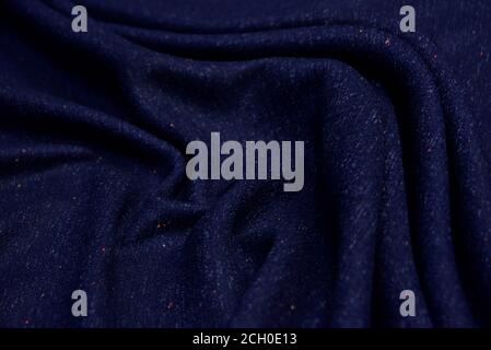 Dark blue wool for coat. Close up texture of the fabric is useful as a background. Stock Photo